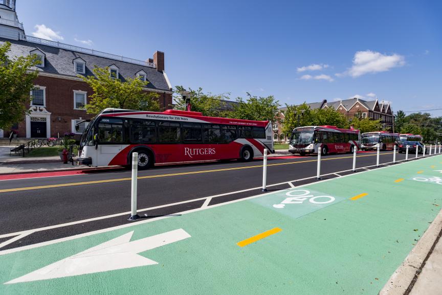 Rutgers-buses-in-the-background-and-a-green-painted-bike-lane-in-the-foregound